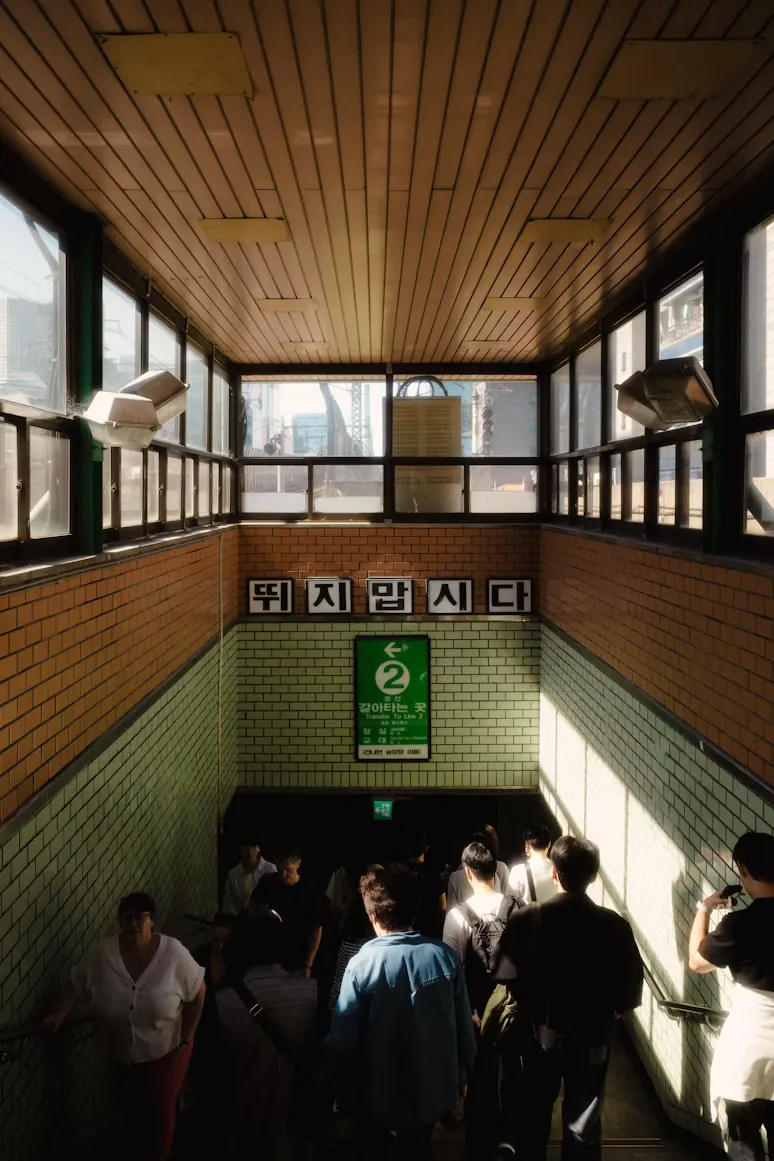 People entering a metro station in Korea
